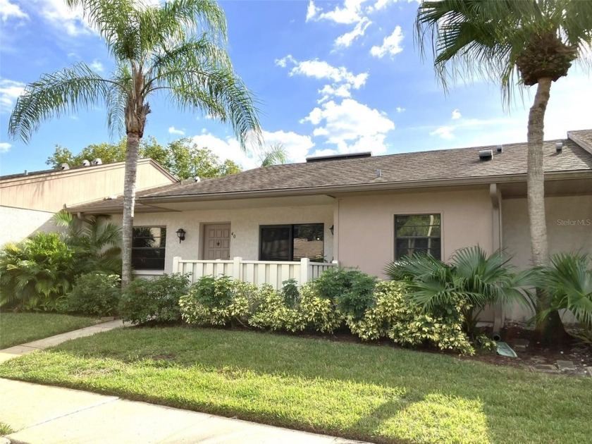 This move in ready villa in desirable East Lake Woodlands offers - Beach Home for sale in Oldsmar, Florida on Beachhouse.com