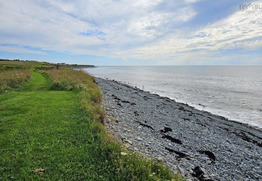 Just over 4 acres of surveyed oceanfront land on beautiful St - Beach Lot for sale in Comeauville,  on Beachhouse.com