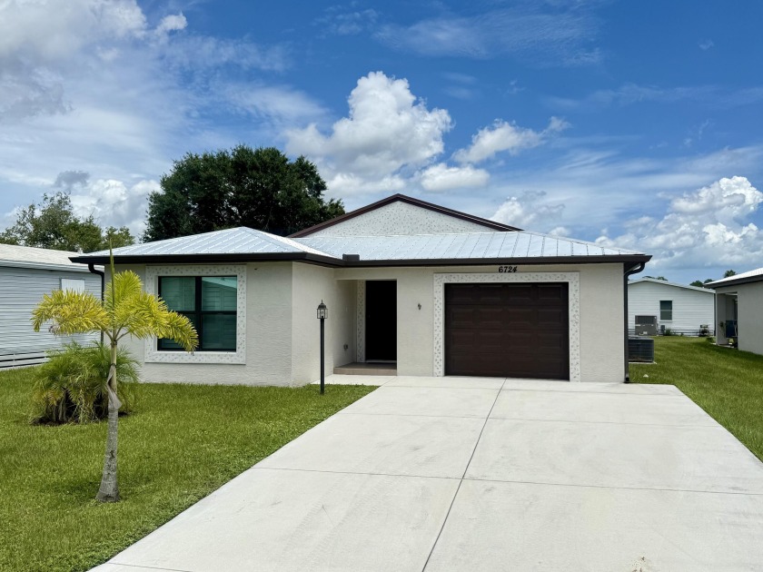 Rare to find new CBS home with many upgrades, Metal Roof, Bright - Beach Home for sale in Fort Pierce, Florida on Beachhouse.com