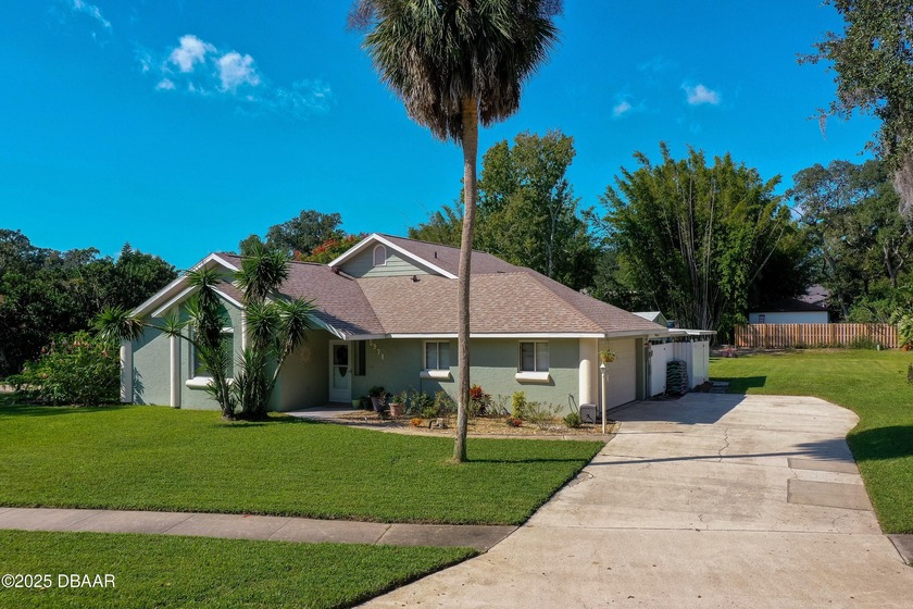 This beautifully maintained home on .5 ACRES features 3-bedrooms - Beach Home for sale in Port Orange, Florida on Beachhouse.com