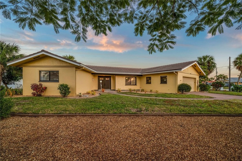 STUNNING WATERFRONT HOME! Days here begin by the water and end - Beach Home for sale in Punta Gorda, Florida on Beachhouse.com