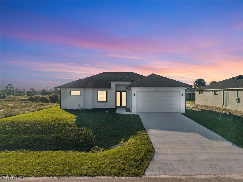 This beautifully built new construction home showcases a fresh - Beach Home for sale in Lehigh Acres, Florida on Beachhouse.com