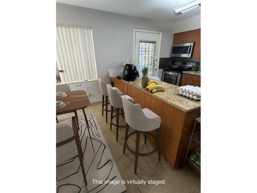 WOW! OPPORTUNITY KNOCKS! This unique home is nestled, amongst - Beach Home for sale in Miami, Florida on Beachhouse.com