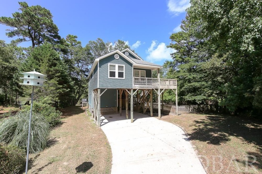Enjoy the quiet setting of this canal front home in the woods of - Beach Home for sale in Kitty Hawk, North Carolina on Beachhouse.com