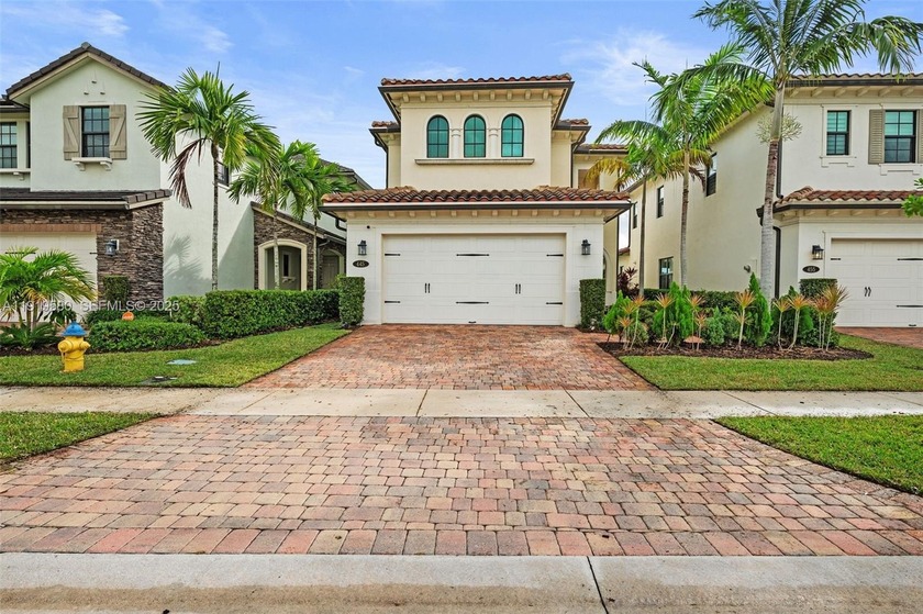 Enjoy serene water views from both the front and backyard of - Beach Home for sale in Pembroke Pines, Florida on Beachhouse.com