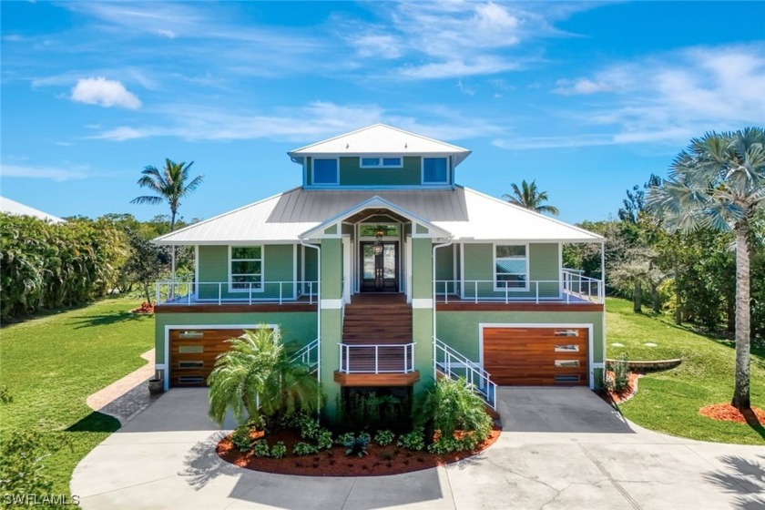 Nestled within a rare 1.28-acre expanse of privacy, this - Beach Home for sale in Fort Myers, Florida on Beachhouse.com