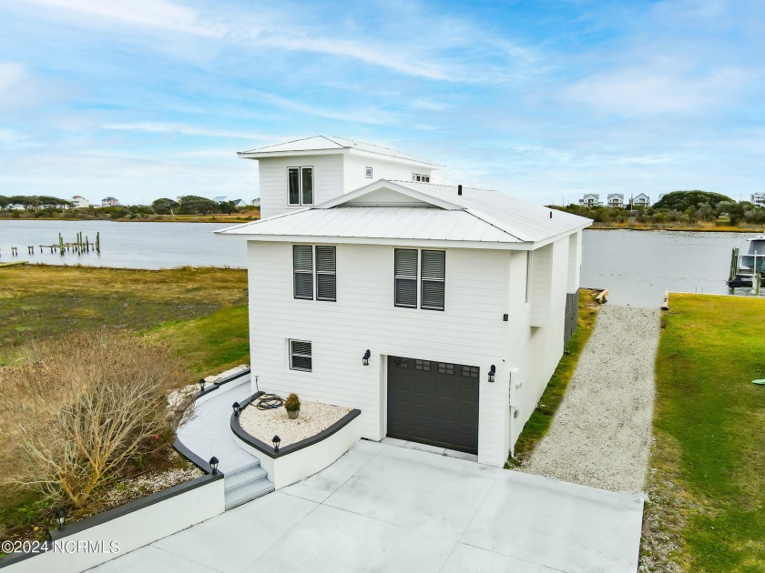 Indulge in waterfront living with this Intracoastal gem! This - Beach Home for sale in Sneads Ferry, North Carolina on Beachhouse.com