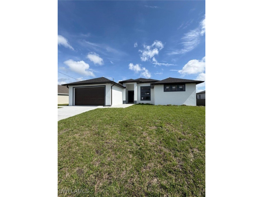 This stunning new construction features impact windows and doors - Beach Home for sale in Cape Coral, Florida on Beachhouse.com