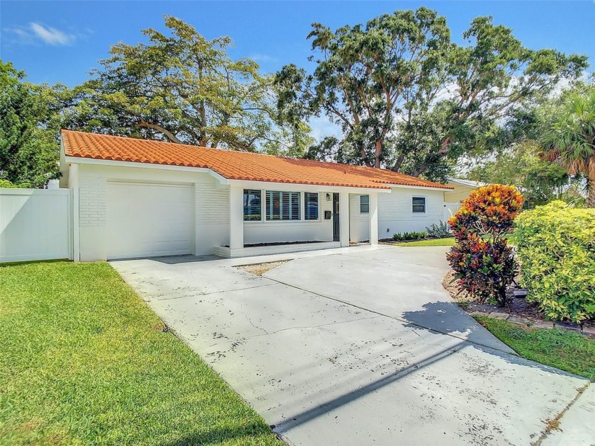 Discover this charming three-bedroom, two-bath home, a perfect - Beach Home for sale in St. Petersburg, Florida on Beachhouse.com