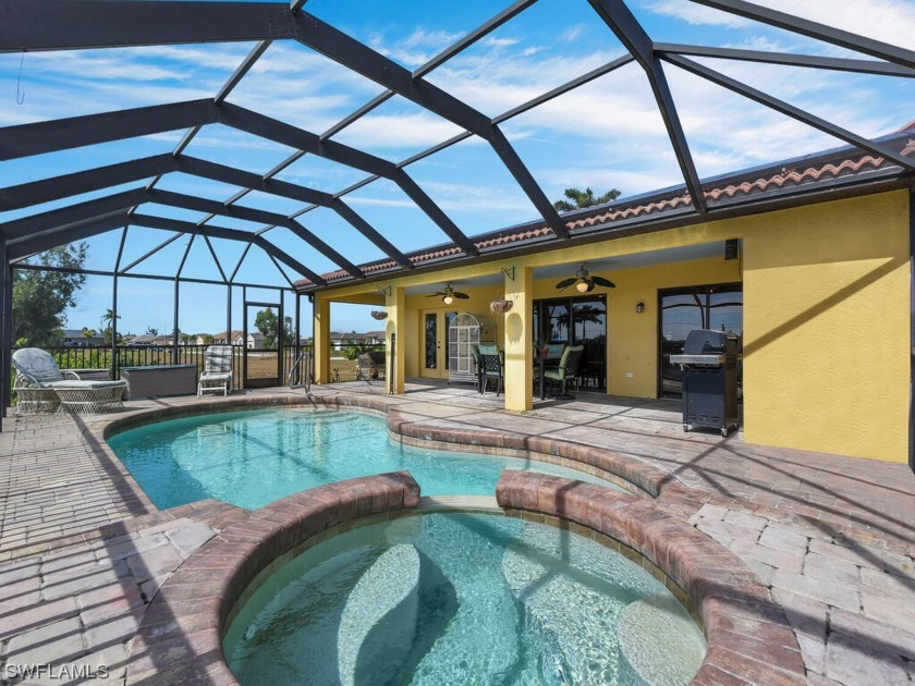 Welcome to this inviting 5-BEDROOM, plus den, family home - Beach Home for sale in Cape Coral, Florida on Beachhouse.com