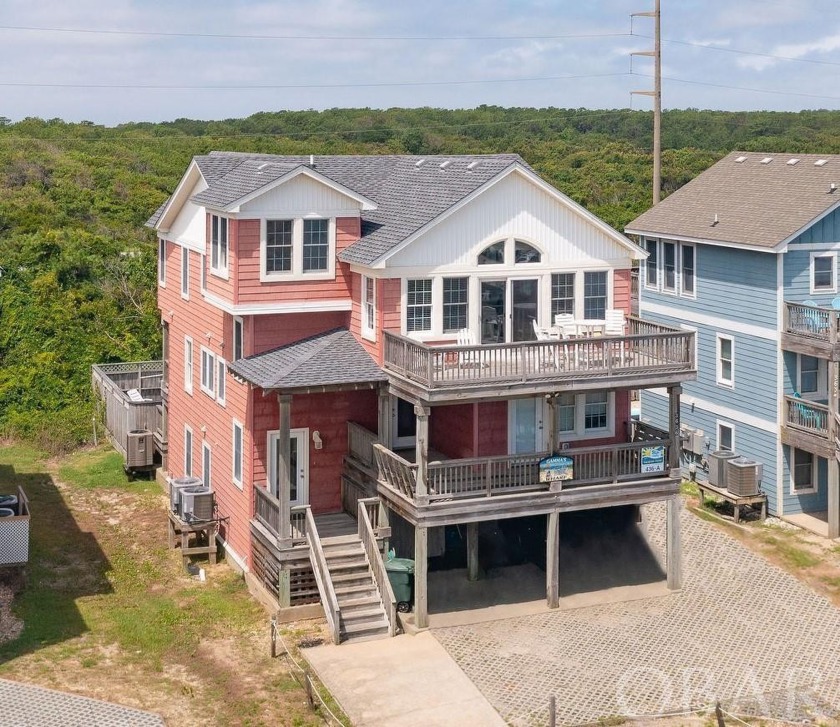 A spacious, six-bedroom, semi-oceanfront home featuring a - Beach Home for sale in Nags Head, North Carolina on Beachhouse.com