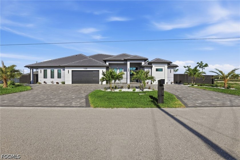 Welcome to 120 9th Ave, a striking custom-built lake-view - Beach Home for sale in Cape Coral, Florida on Beachhouse.com