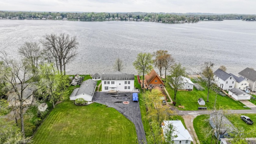 Escape to this Rare Grand property on Paw Paw Lake! This - Beach Home for sale in Coloma, Michigan on Beachhouse.com