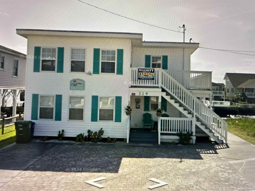 This Charming Multi Family 5 Bedroom,5 bath home nestled on the - Beach Home for sale in North Myrtle Beach, South Carolina on Beachhouse.com