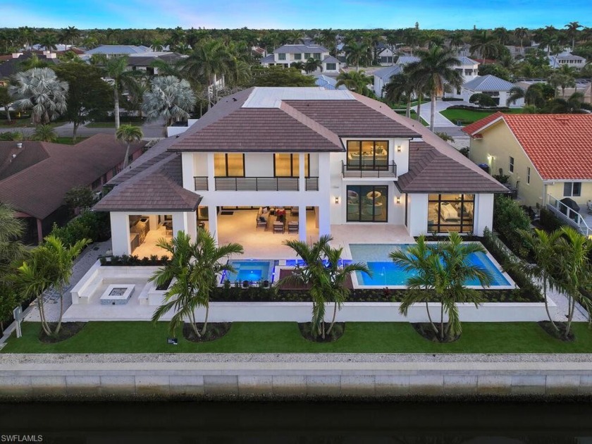 An exceptional new home in quiet Aqualane Shores - moments to - Beach Home for sale in Naples, Florida on Beachhouse.com