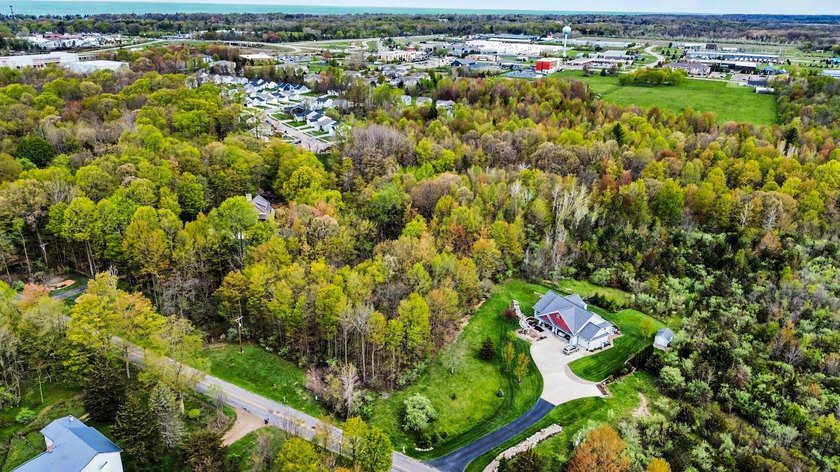 Nestled on 3 serene, wooded acres in South Haven Township, this - Beach Acreage for sale in South Haven, Michigan on Beachhouse.com