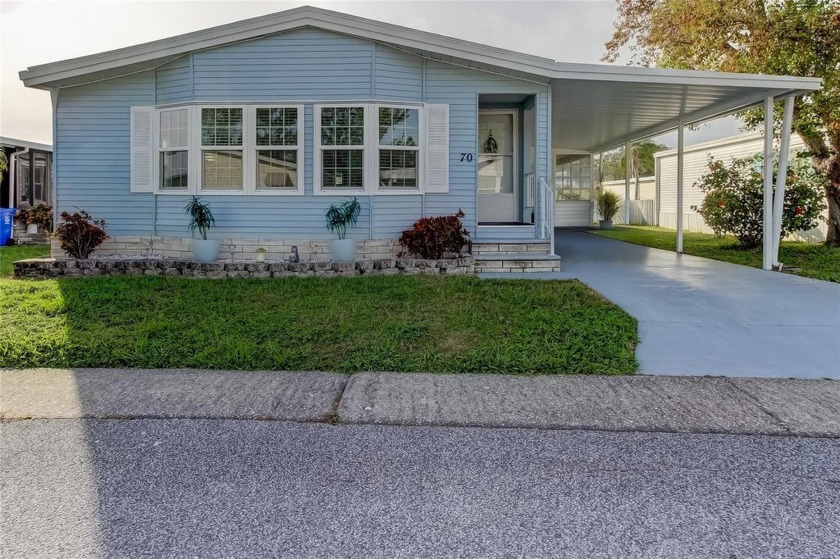 STEP INSIDE AND ESCAPE TO THIS IMPECCABLY DECORATED, OPEN - Beach Home for sale in Oldsmar, Florida on Beachhouse.com