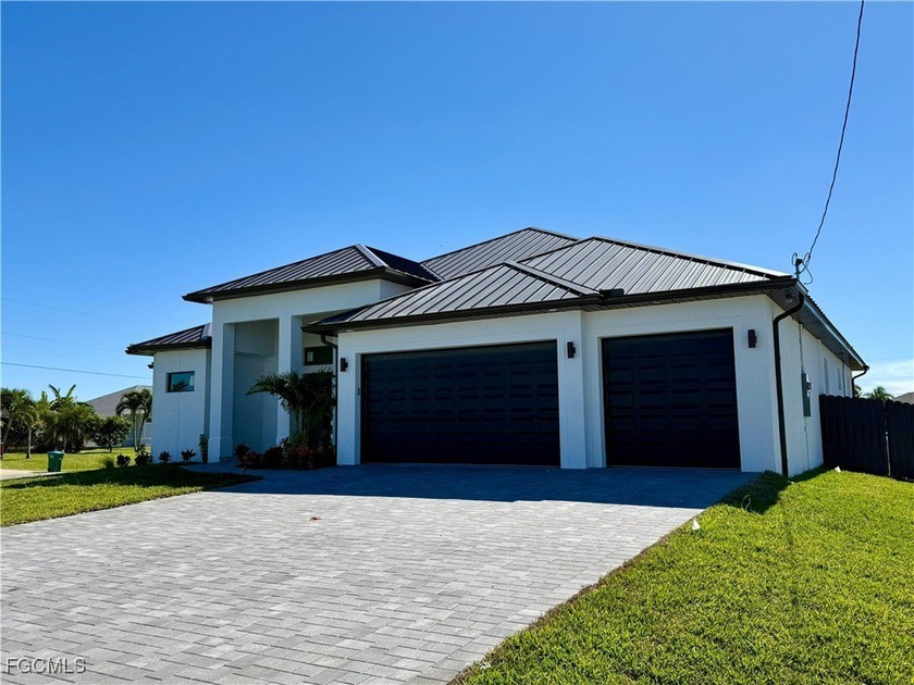 Introducing this brand-new construction in Cape Coral! This - Beach Home for sale in Cape Coral, Florida on Beachhouse.com