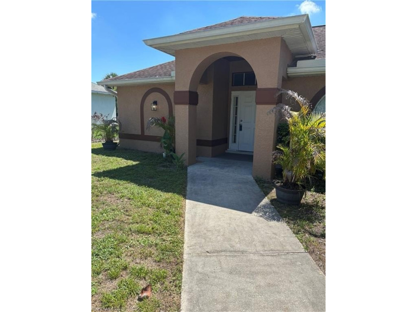 Well-maintained 4-bedroom, 2-bath single-family home situated on - Beach Home for sale in Lehigh Acres, Florida on Beachhouse.com