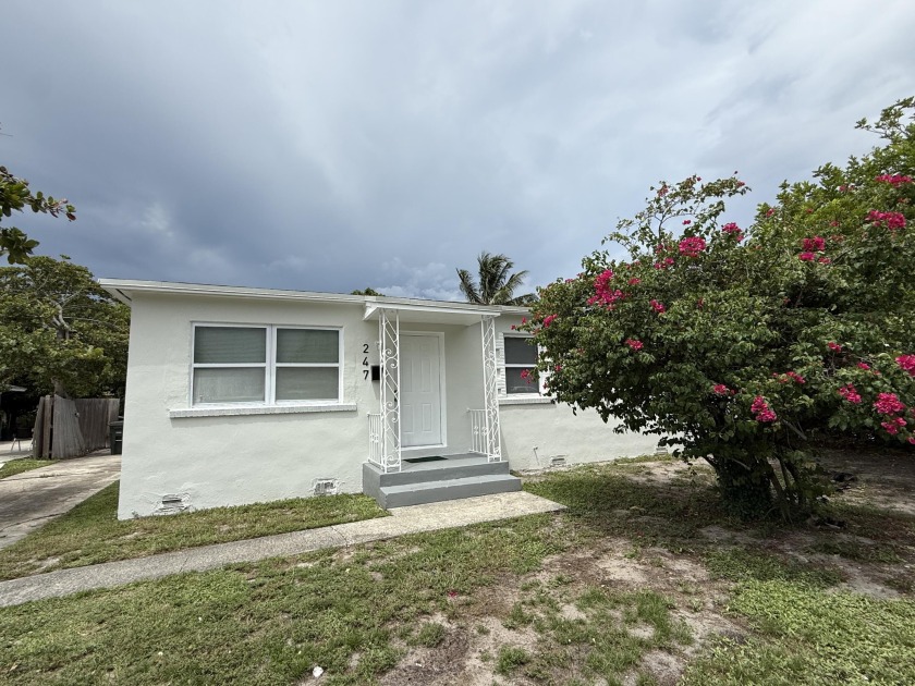 Charming and move-in ready 3-bed, 1-bath home ideally located - Beach Home for sale in Lake Park, Florida on Beachhouse.com