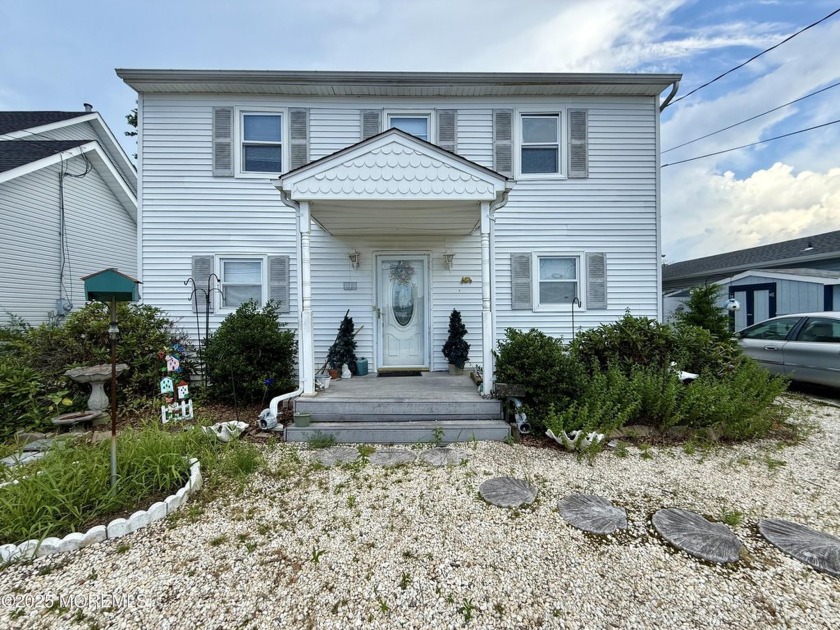 This 3 bedroom, 2 bath waterfront home set on a peaceful - Beach Home for sale in Forked River, New Jersey on Beachhouse.com