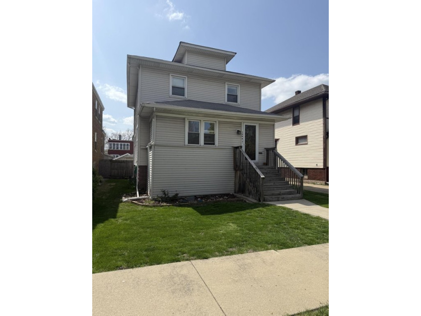 Discover the potential of this spacious two-story home ideally - Beach Home for sale in Whiting, Indiana on Beachhouse.com