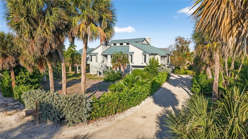 Welcome to 4400 Gulf Pines Drive, an elevated coastal home set - Beach Home for sale in Sanibel, Florida on Beachhouse.com