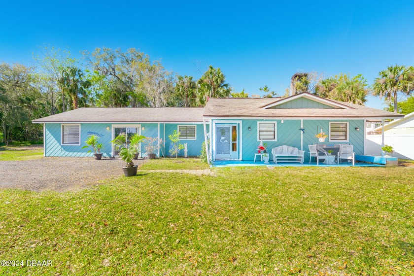 THE BLUE HOUSE ON THE TOMOKA RIVER! STUNING OASIS! Quaintly - Beach Home for sale in Ormond Beach, Florida on Beachhouse.com