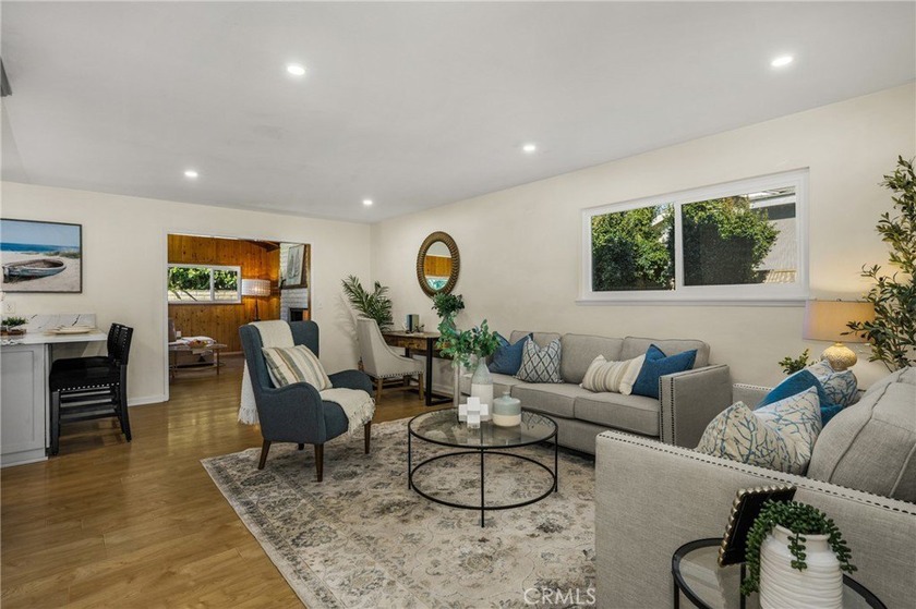 This beautifully refreshed single-level home is situated on a - Beach Home for sale in Huntington Beach, California on Beachhouse.com