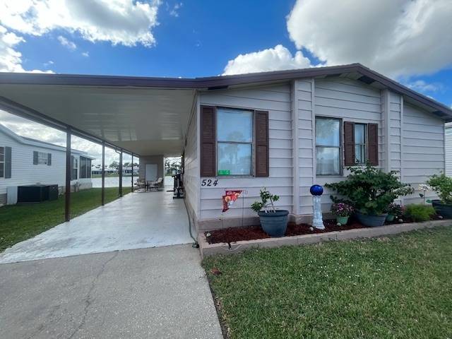 Retire on a lake in a 55+ community, with spa type amenities - Beach Home for sale in Melbourne, Florida on Beachhouse.com