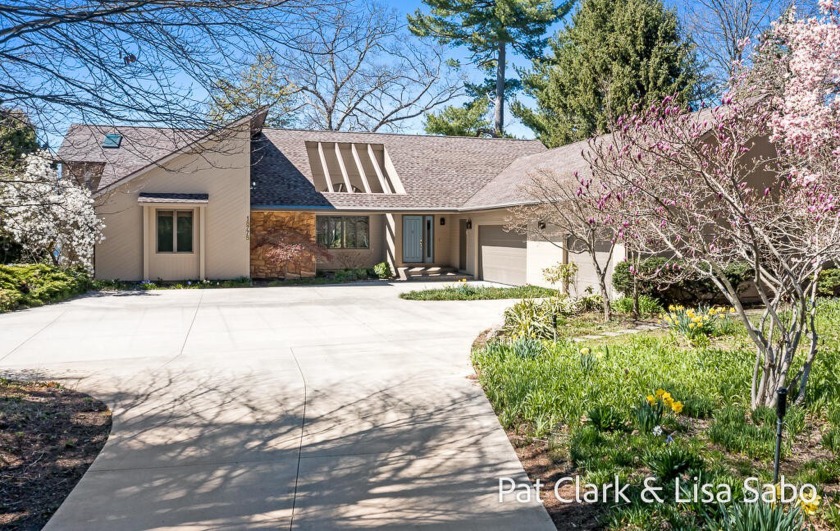 This custom-built home boasts a well-thought-out open floor plan - Beach Home for sale in Spring Lake, Michigan on Beachhouse.com
