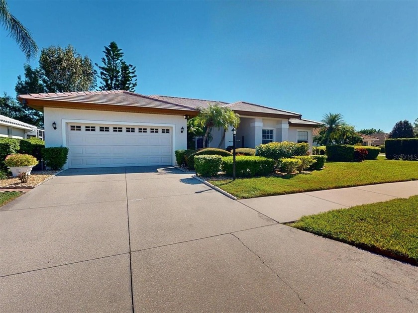 This exceptional highly desirable McIntosh Lakes three-bedroom - Beach Home for sale in Sarasota, Florida on Beachhouse.com