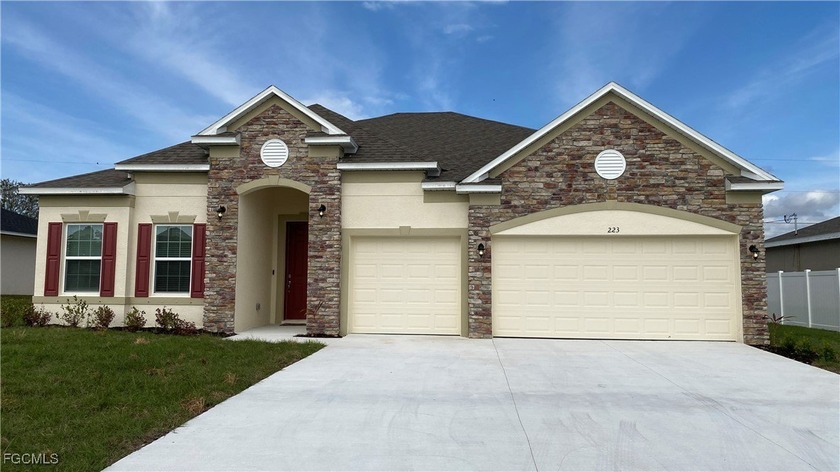 This modern 4-bedroom, 3-bath residence with a spacious 3-car - Beach Home for sale in Cape Coral, Florida on Beachhouse.com