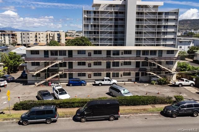 Concrete apartment building containing 15 (2-bdrm) units with 21 - Beach Lot for sale in Honolulu, Hawaii on Beachhouse.com