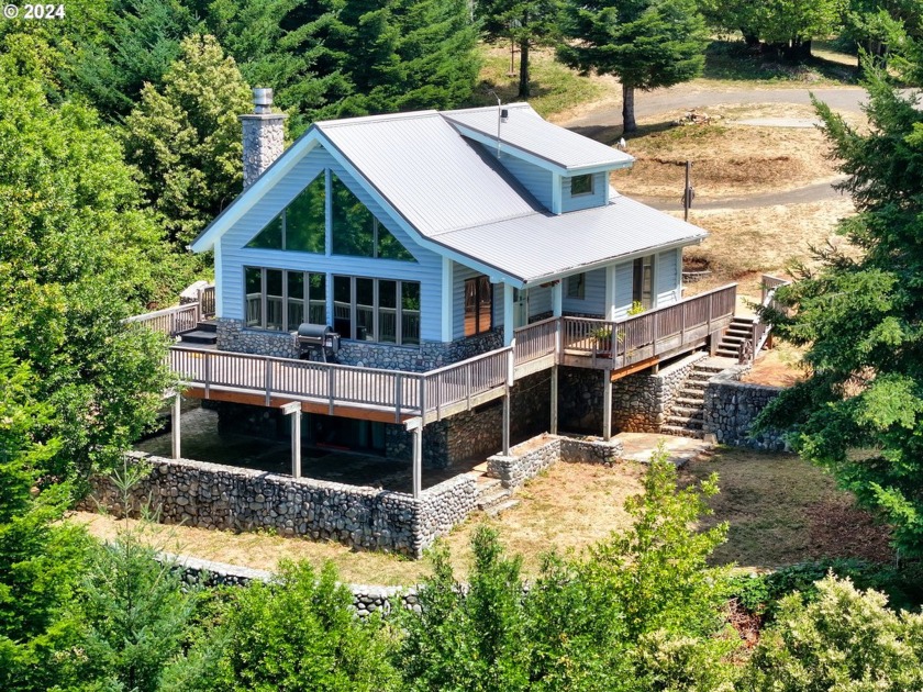 54 plus acres surrounds this amazing contemporary log home. Here - Beach Home for sale in Port Orford, Oregon on Beachhouse.com