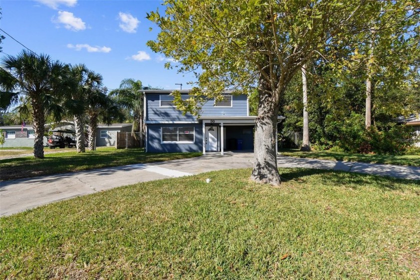 Waterfront find in desirable Dunedin!!  This two story home sits - Beach Home for sale in Dunedin, Florida on Beachhouse.com