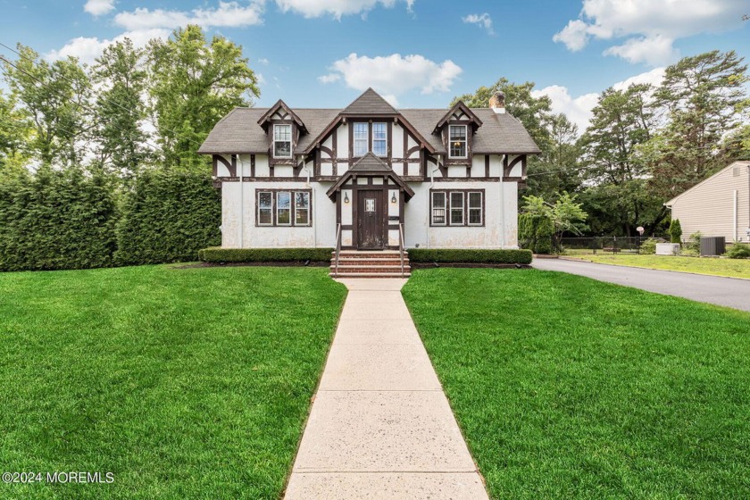 Nestled in the heart of Oakhurst, this charming Tudor home - Beach Home for sale in Oakhurst, New Jersey on Beachhouse.com