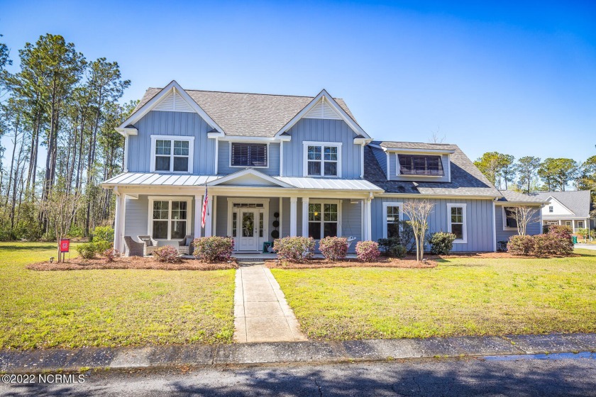 This custom home is tucked away off Middle Sound Loop in the - Beach Home for sale in Wilmington, North Carolina on Beachhouse.com