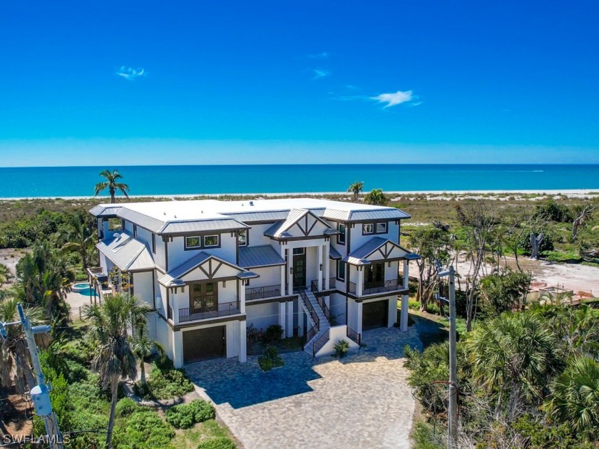 Step into the definition of coastal elegance with this - Beach Home for sale in Sanibel, Florida on Beachhouse.com