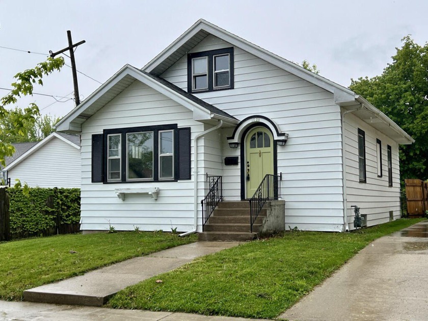 Situated on a beautiful tree-lined street, this fully rehabbed - Beach Home for sale in Racine, Wisconsin on Beachhouse.com