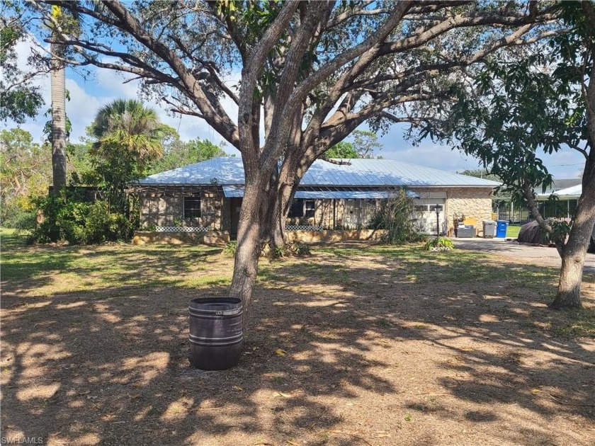 HUGE PRICE REDUCTION! Riverfront home equipped with a boat lift - Beach Home for sale in Bonita Springs, Florida on Beachhouse.com