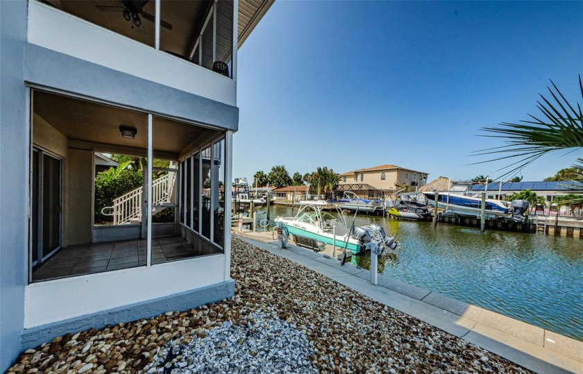 Welcome home! This WATERFRONT, ground floor, end unit Dunedin - Beach Condo for sale in Dunedin, Florida on Beachhouse.com