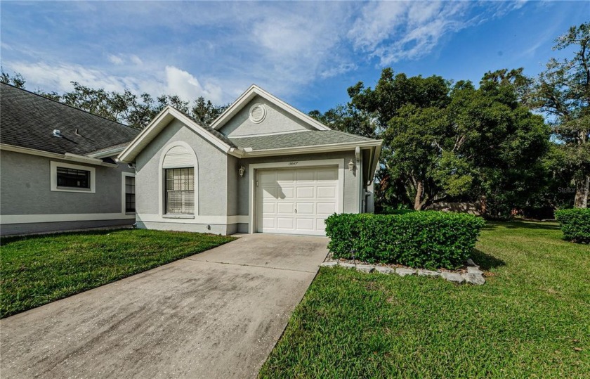 Welcome to your serene sanctuary in the exclusive, gated Golf - Beach Home for sale in New Port Richey, Florida on Beachhouse.com