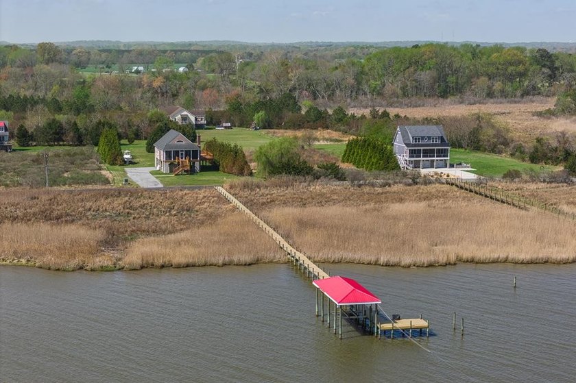 Experience true waterfront living with this custom-built - Beach Home for sale in Dunnsville, Virginia on Beachhouse.com