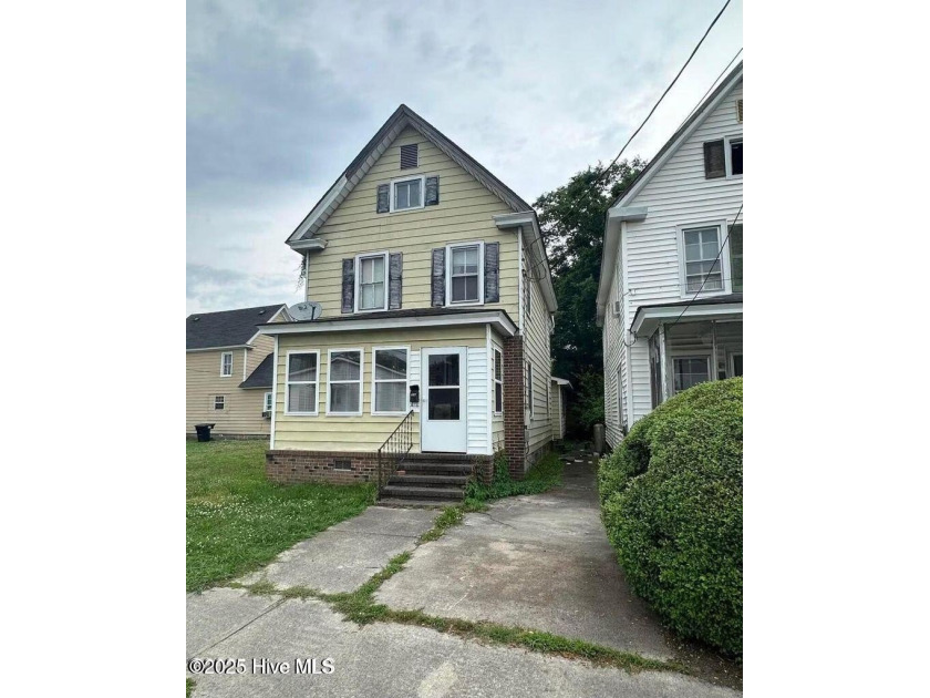 Step into potential with this 3-bedroom, 1.5-bath home that's - Beach Home for sale in Elizabeth City, North Carolina on Beachhouse.com