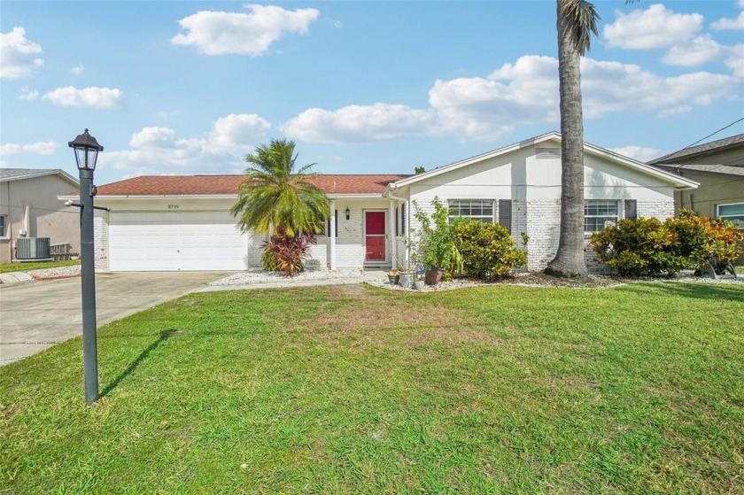 Welcome to 8719 Hickorywood Ln, a rare waterfront opportunity in - Beach Home for sale in Tampa, Florida on Beachhouse.com