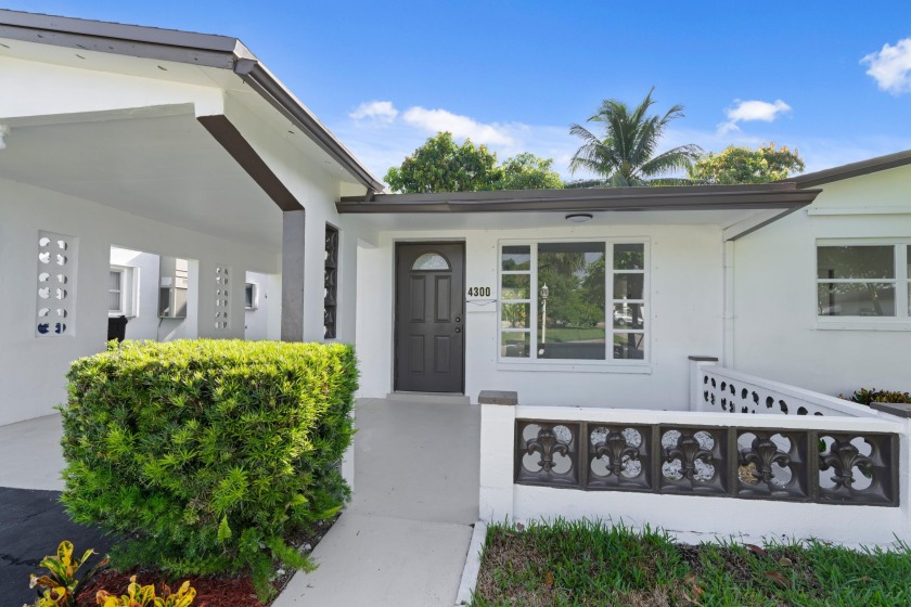 Welcome to this beautifully renovated single-family home nestled - Beach Home for sale in Lauderdale Lakes, Florida on Beachhouse.com