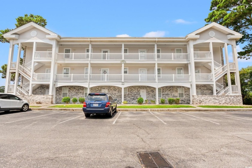 Enjoy beautiful first-row views of Myrtlewood Golf Course from - Beach Condo for sale in Myrtle Beach, South Carolina on Beachhouse.com