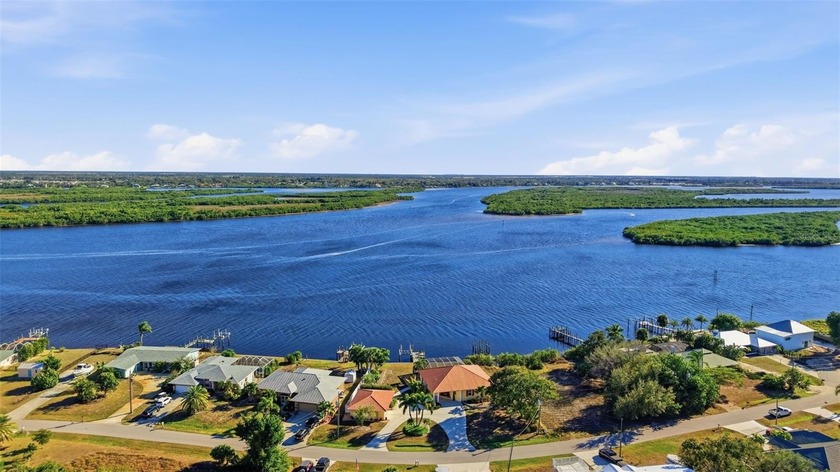 RIVERFRONT, SAILBOAT ACCESS POOL HOME WITH 100 FEET OF CONCRETE - Beach Home for sale in Punta Gorda, Florida on Beachhouse.com