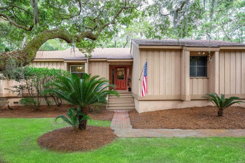 Surrounded by gorgeous southern Live Oaks and palm trees, this - Beach Home for sale in Seabrook Island, South Carolina on Beachhouse.com